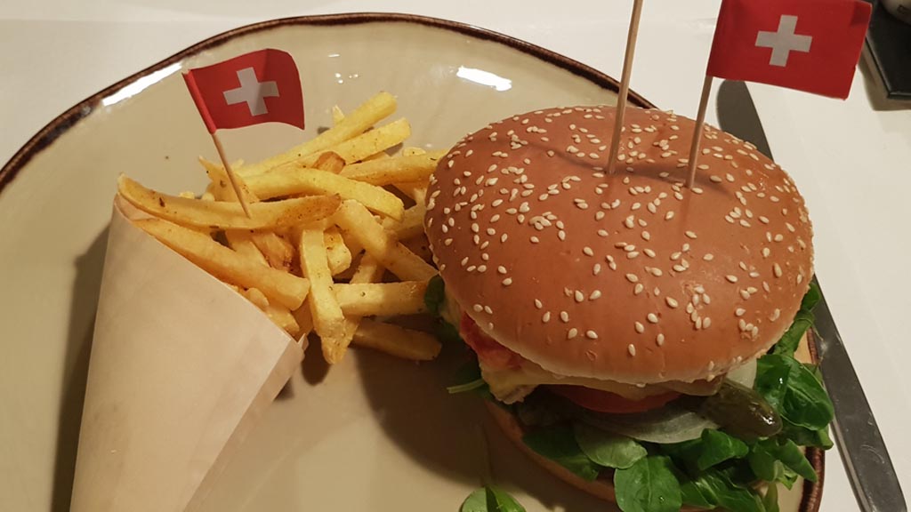 A very ordinary, but not Swiss traditional, burger and fries... with a flag