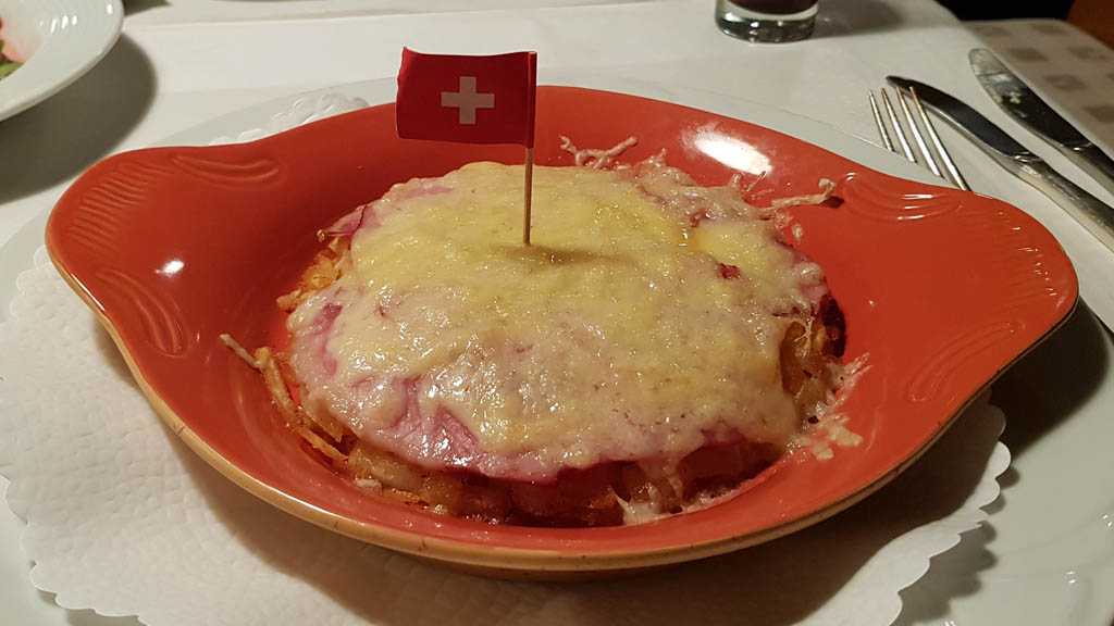 The famous Swiss potato rösti, with ham and cheese